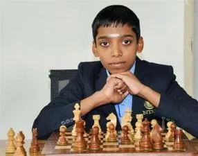 Who is the 16 year old boy chess champion?