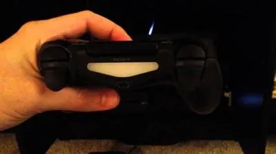 How do i reset the orange light on my ps4 controller?